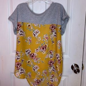 A half gray and half yellow floral top